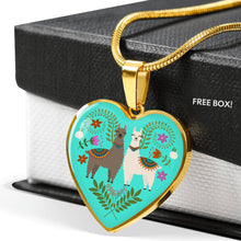Load image into Gallery viewer, Llama and Flower Design on Turquoise Background Heart Shaped Pendant In Gold or Silver