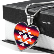Load image into Gallery viewer, Heart Shaped Pendant With Tribal Design on Purple, Orange and Red Serape Background
