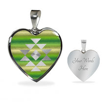 Load image into Gallery viewer, Heart Shaped Pendant With Tribal Element on Green and Tan Serape Style Background
