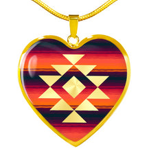 Load image into Gallery viewer, Heart Shaped Pendant With Tribal Design on Purple, Orange and Red Serape Background
