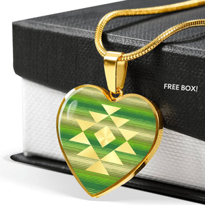 Heart Shaped Pendant With Tribal Element on Green and Tan Serape Style Background
